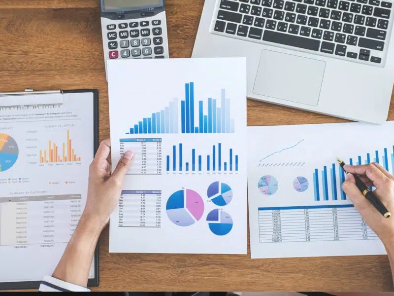 reviewing sales and inventory on paper