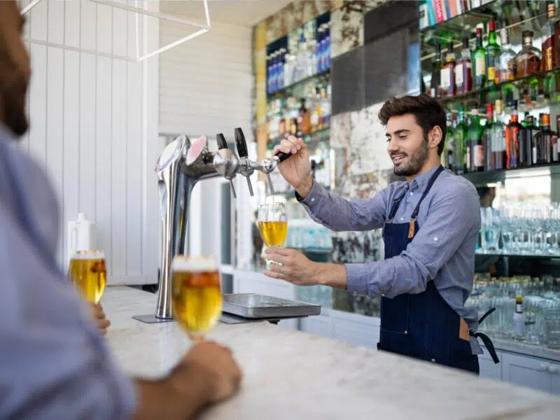 bartender pouring a beer
