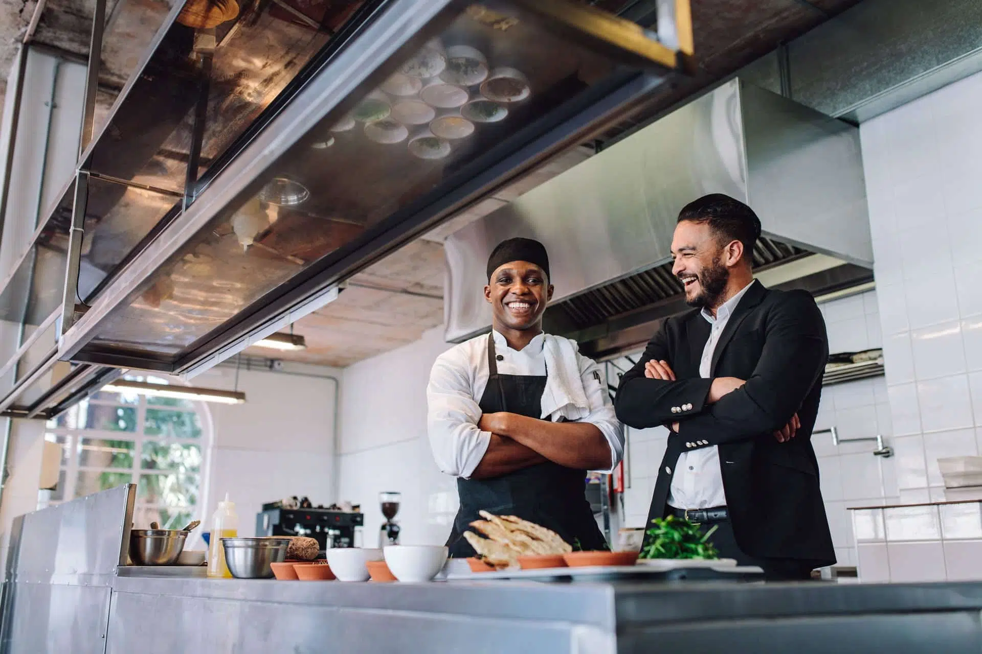 manager and kitchen staff working together