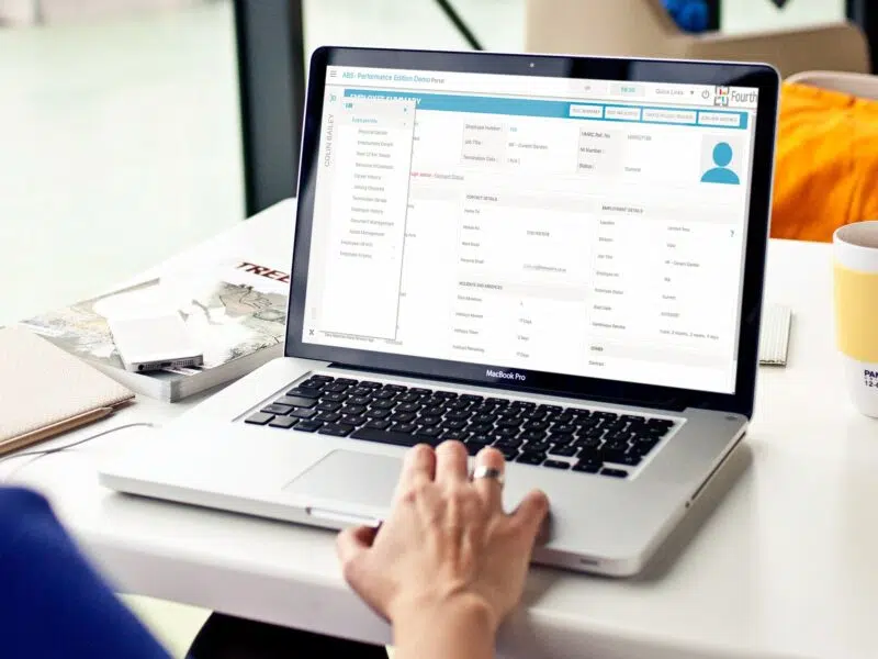 Fourth's HR software interface on a laptop