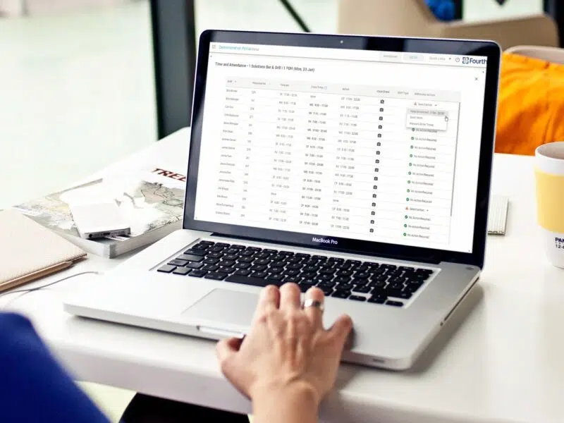 Fourth time and attendance software being used on a laptop.