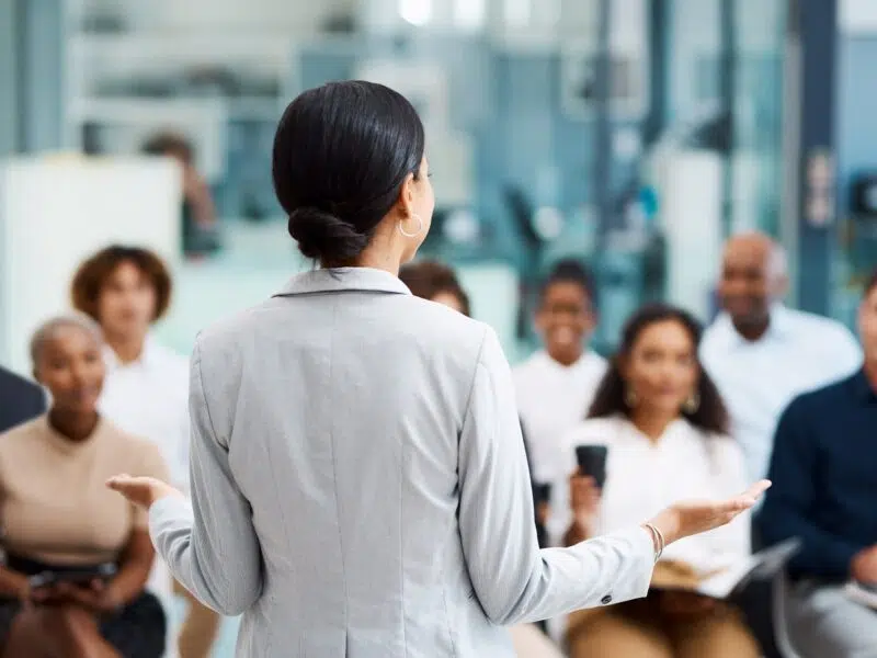 Woman speaking to recruitment candidates