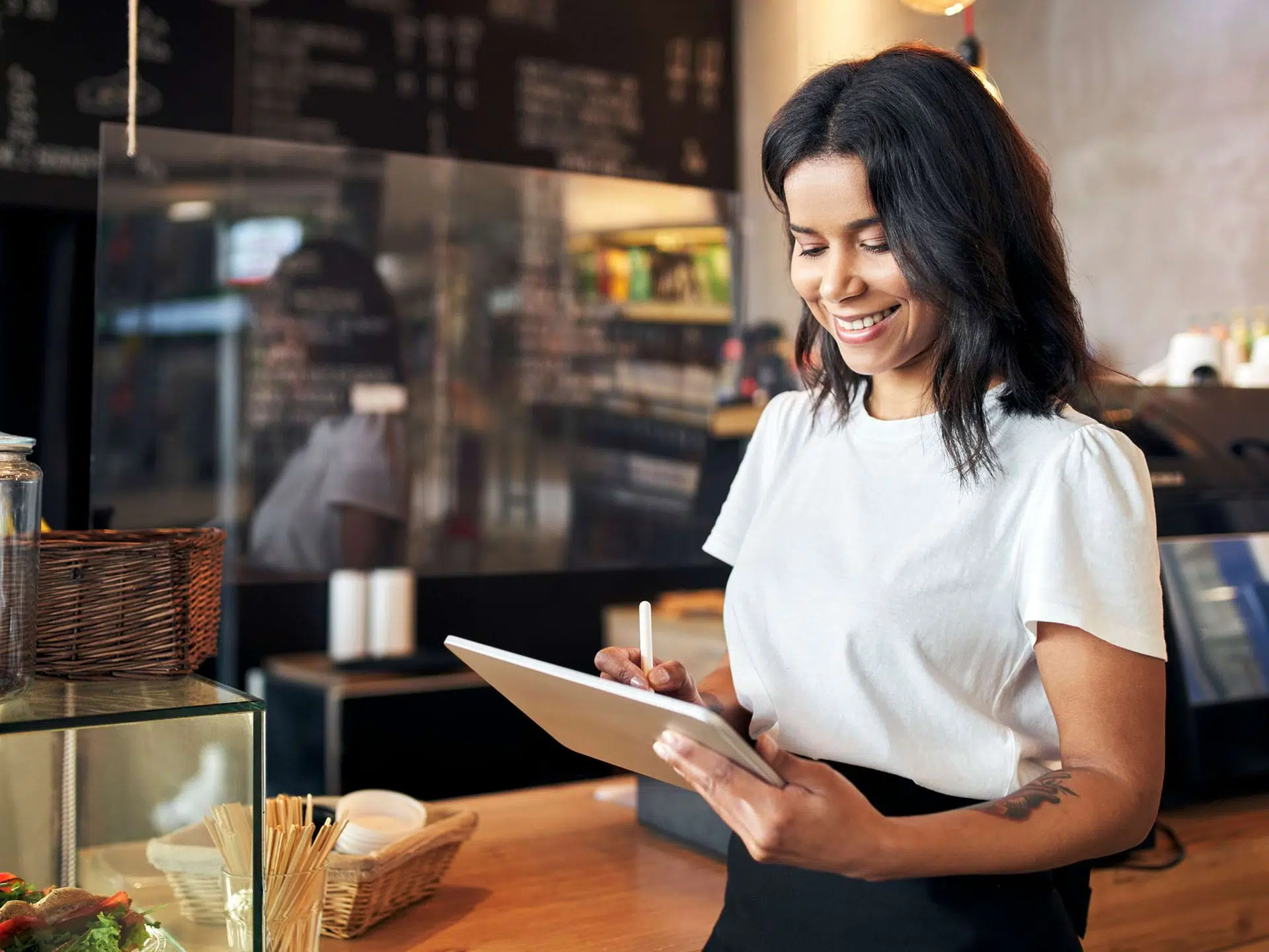 restaurant worker using a tablet
